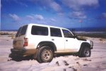 Alan's Landcruiser on a dune near Warren River