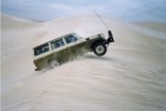 Alan's FJ55 Cruiser flying over a dune!