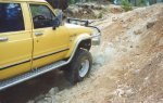 Hilux climbing a rocky hill