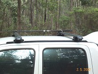 Rhino Rack with Aero bars, commercial leg, and track mount system.